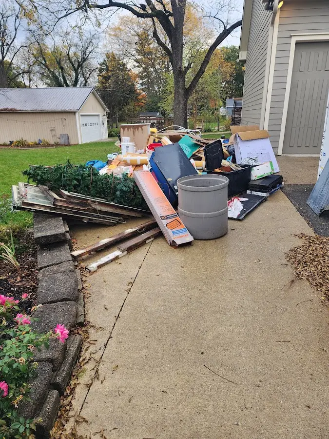 Dumpster being loaded with debris for Estate Cleanout Dumpster Rental in Richfield